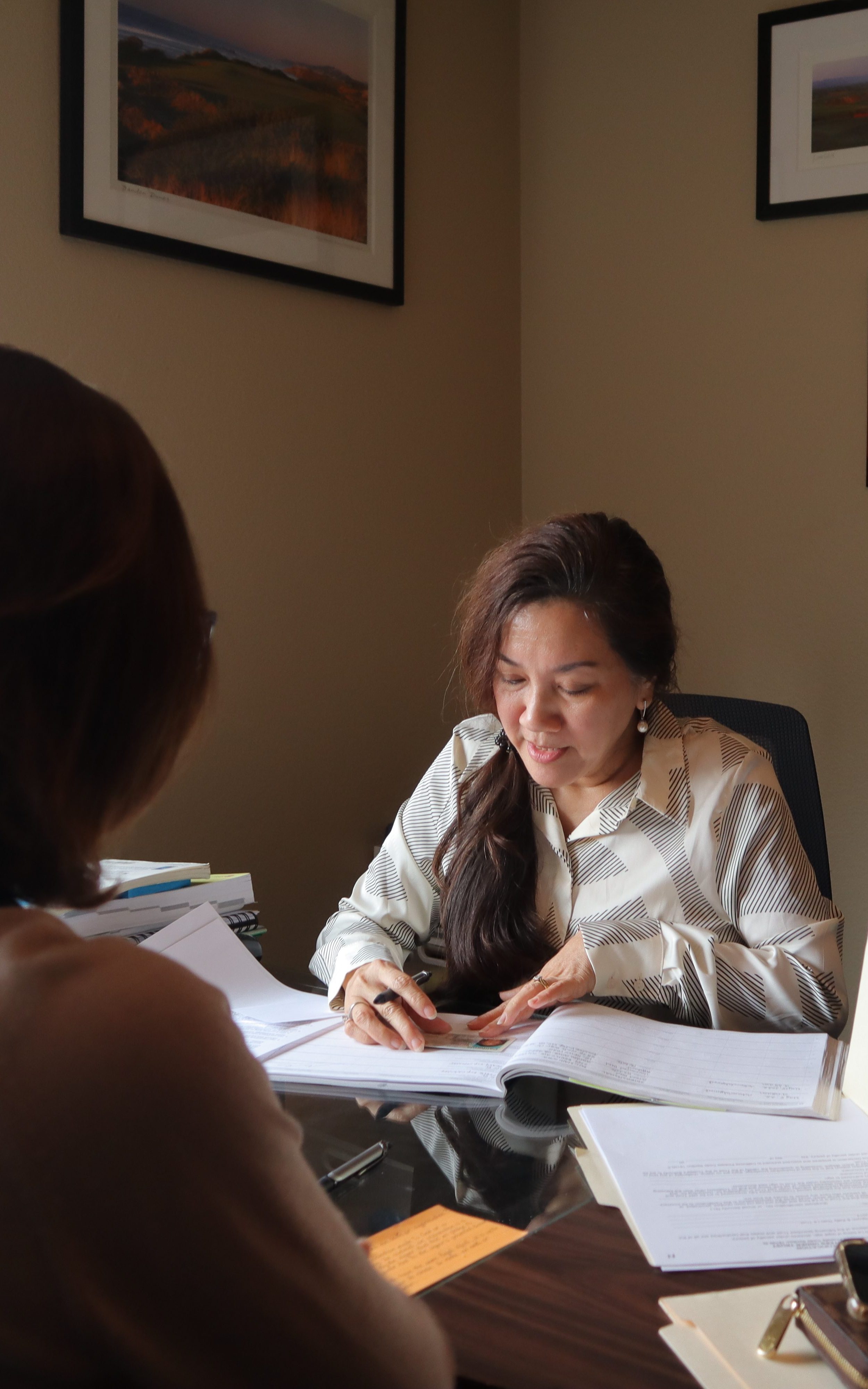 The notary public, Ha VanderVorst, certifying the identity of a customer